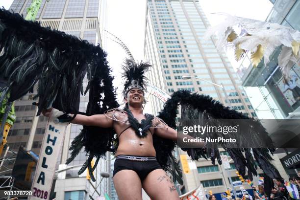 People lined the sidewalks along Yonge Street to witness the Annual Pride Parade on a rainy and wet day in Toronto, Canada, on June 24, 2018