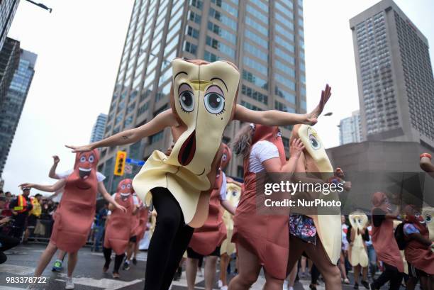 People lined the sidewalks along Yonge Street to witness the Annual Pride Parade on a rainy and wet day in Toronto, Canada, on June 24, 2018