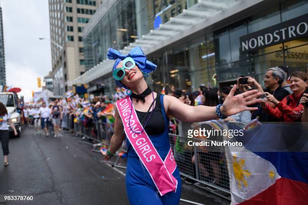 People lined the sidewalks along Yonge Street to witness the Annual Pride Parade on a rainy and wet day in Toronto, Canada, on June 24, 2018