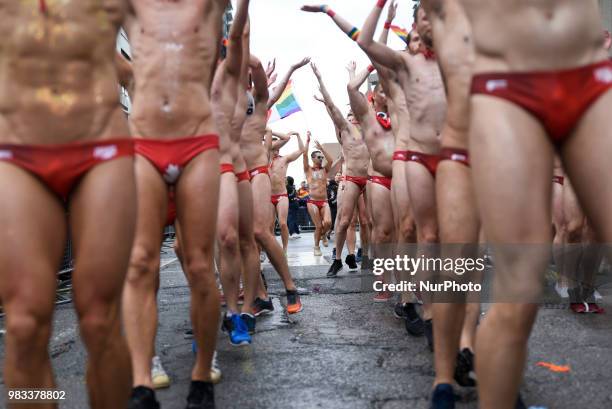 People lined the sidewalks along Yonge Street to witness the Annual Pride Parade on a rainy and wet day in Toronto, Canada, on June 24, 2018