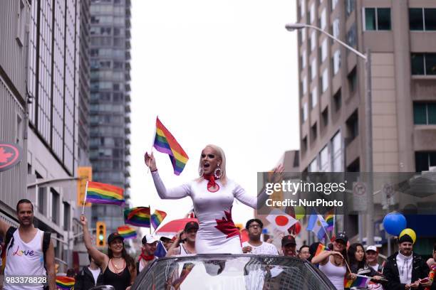 People lined the sidewalks along Yonge Street to witness the Annual Pride Parade on a rainy and wet day in Toronto, Canada, on June 24, 2018