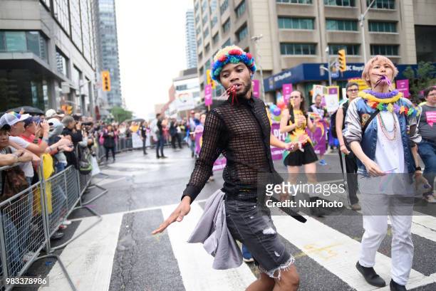 People lined the sidewalks along Yonge Street to witness the Annual Pride Parade on a rainy and wet day in Toronto, Canada, on June 24, 2018
