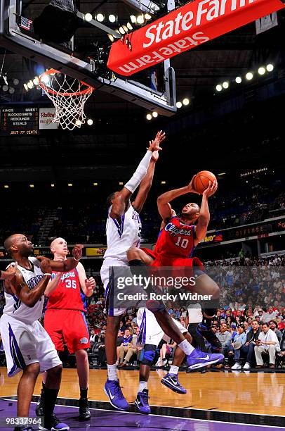 Eric Gordon of the Los Angeles Clippers gets to the basket against Jason Thompson of the Sacramento Kings on April 8, 2010 at ARCO Arena in...