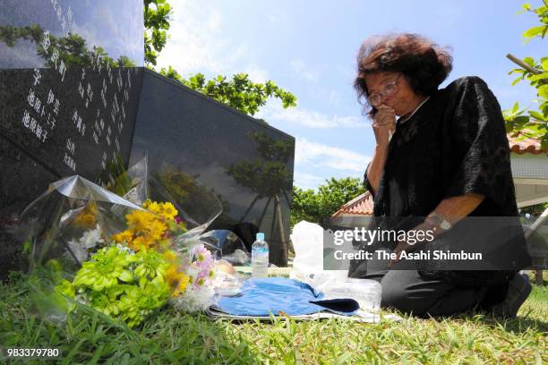 Year-old Sono Kuniyoshi sheds tears in front of the Cornerstone of Peace where the names of their bereaved family members and relatives engraved at...