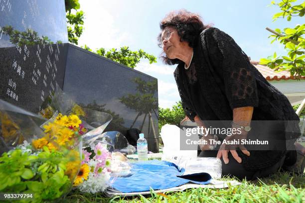 Year-old Sono Kuniyoshi sheds tears in front of the Cornerstone of Peace where the names of their bereaved family members and relatives engraved at...