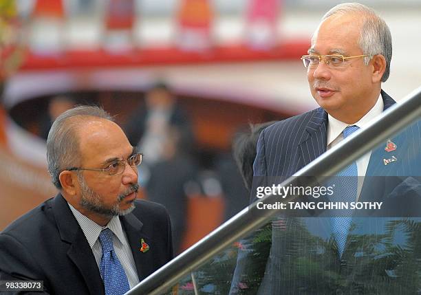 Malaysian Prime Minister Najib Razak talks to Secretary-General of Malaysia Tan Sri Rastam Mohd Isa attends the Association of Southeast Asian...