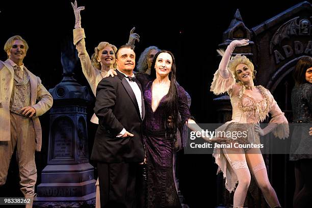 Actors Nathan Lane and Bebe Neuwirth join the cast of "The Adams Family" as they take a bow following the opening night of the Broadway production of...