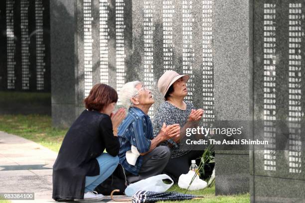 People visit the Cornerstone of Peace where the names of their bereaved family members and relatives engraved at the Peace Memorial Park on the 73rd...