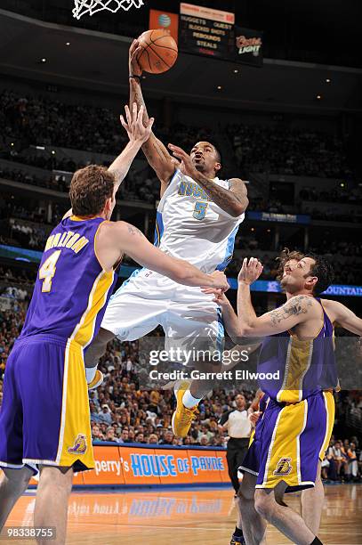 Smith of the Denver Nuggets goes to the basket against Luke Walton and Jordan Farmar the Los Angeles Lakers on April 8, 2010 at the Pepsi Center in...