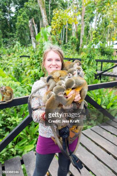 woman and squirrel monkeys - dödskalleapa bildbanksfoton och bilder