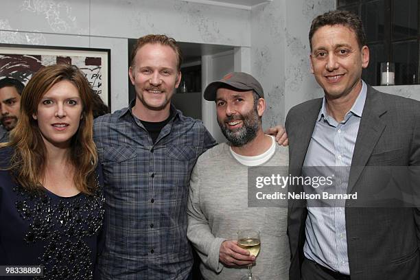 Host Sara Schiller, filmmaker Morgan Spurlock, host Marc Schiller and producer John Sloss attend the private screening for the new Banksy film "Exit...