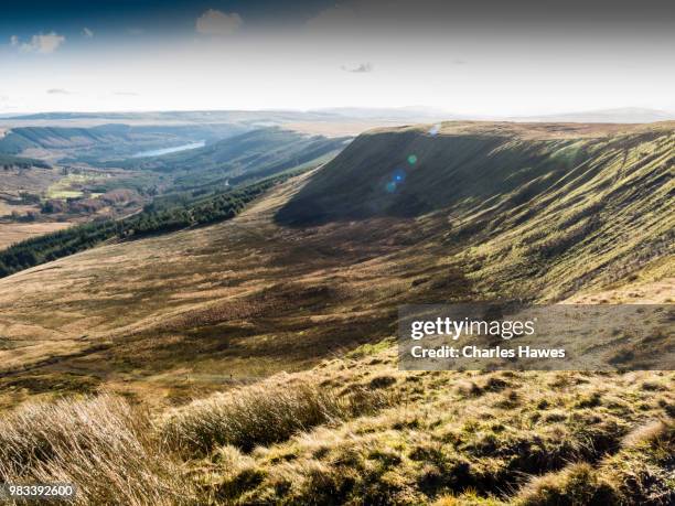 view to upper neuadd reservoir from graig fan ddu. image from a circular walk taking in the peaks of corn du and pen y fan in the brecon beacons national park, south wales, uk. january - pen y fan stock pictures, royalty-free photos & images