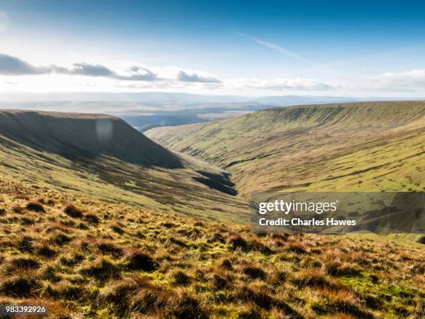view down valley called cwm crew from near corn du. image from a circular walk taking in the peaks of corn du and pen y fan in the brecon beacons national park, south wales, uk. january - pen y fan stock pictures, royalty-free photos & images