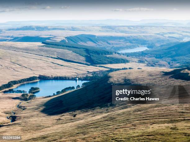 view to upper neuadd reservoir from corn du;image from a circular walk taking in the peaks of corn du and pen y fan in the brecon beacons national park, south wales, uk. january - pen y fan stock pictures, royalty-free photos & images