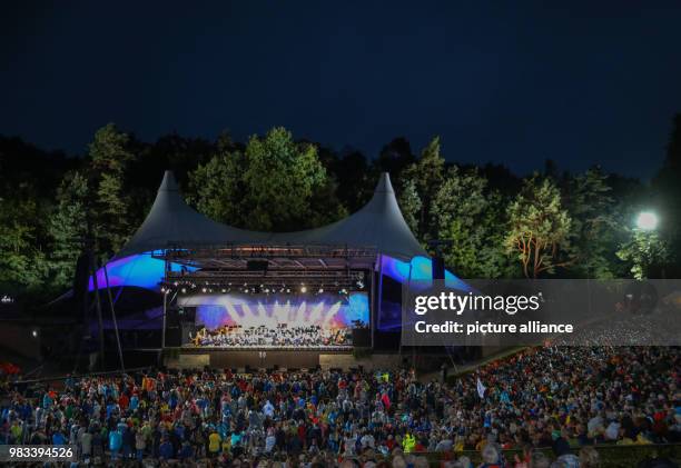 June 2018, Germany, Berlin: Sir Simon Rattle conducting during his last concert with the Berliner Philharmonie in the Waldbuehne. Rattle retired...