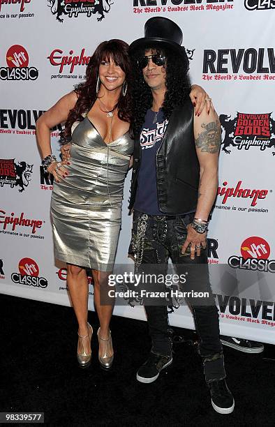 Perla Ferrar and musician Slash arrive at the 2nd annual Revolver Golden Gods Awards held at Club Nokia on April 8, 2010 in Los Angeles, California.