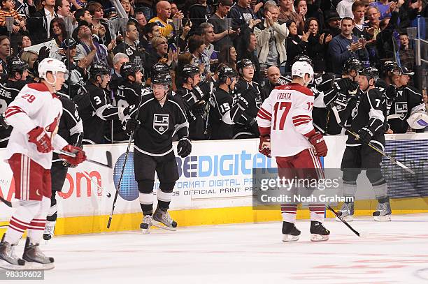 Drew Doughty and Rob Scuderi of the Los Angeles Kings celebrate with the bench after a goal against the Phoenix Coyotes on April 8, 2010 at Staples...