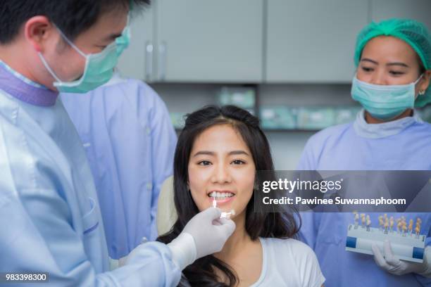 asian woman with palette for tooth color - color palette bildbanksfoton och bilder