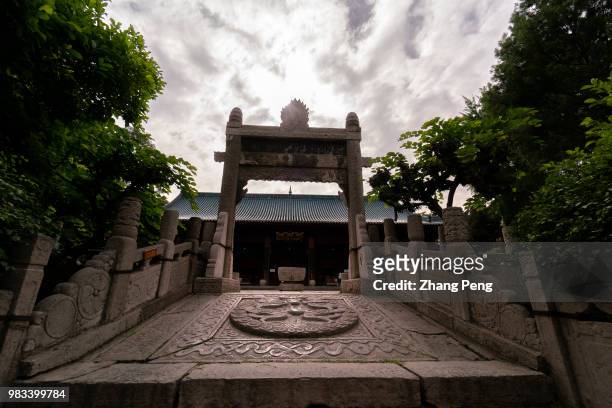 Ancient stone steps and Pailou, carved with imperial dragon. Xi'an Great Mosque which is a blend of traditional Chinese and Islamic architecture...