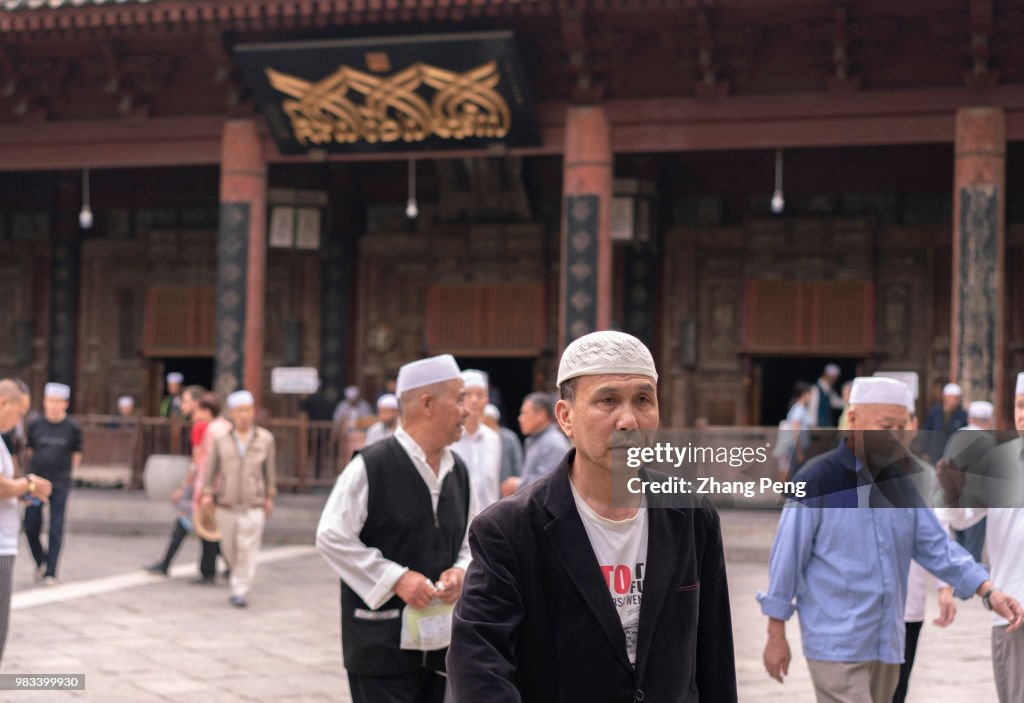 Muslim men seen in the square in front of the main hall of...