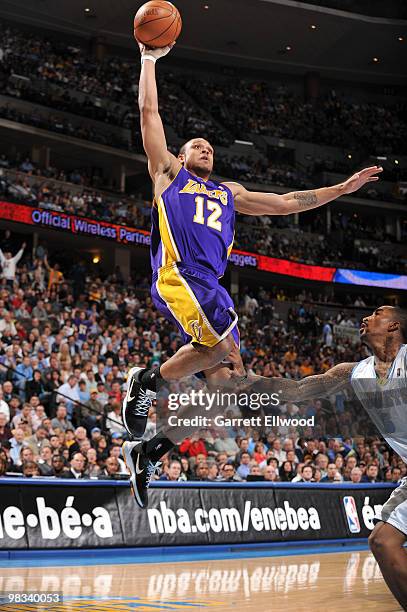 Shannon Brown of the Los Angeles Lakers goes to the basket against J.R. Smith of the Denver Nuggets on April 8, 2010 at the Pepsi Center in Denver,...