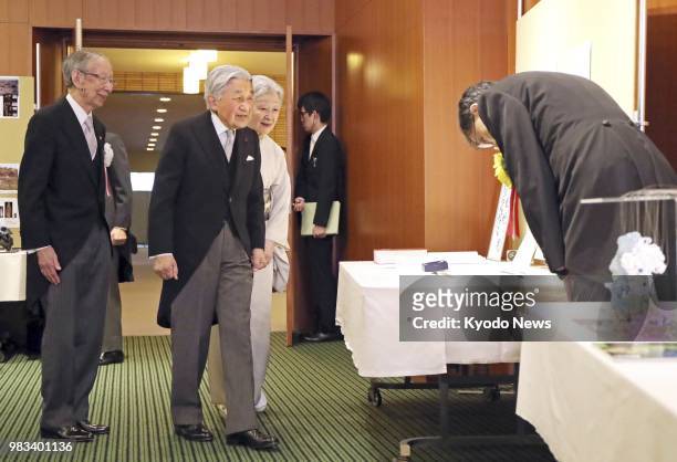 Japanese Emperor Akihito and Empress Michiko visit the Japan Academy hall in Tokyo to see research materials of the academy's award recipients on...