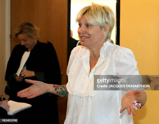 French TV host Maitena Biraben gestures as she leaves the Conseil des Prud'hommes in Boulogne-Billancourt, west of Paris, on June 25, 2018 as she...