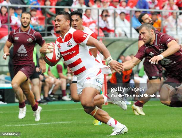 Lomano Lava Lemeki of Japan makes a break to score his side's second try during the rugby international match between Japan and Georgia at Toyota...