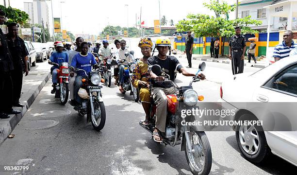 Sonia BAKARIC Public transport motocyclists popularly known as Okada compete with taxis on Lagos roads on April 7, 2010. Despite the effort being...