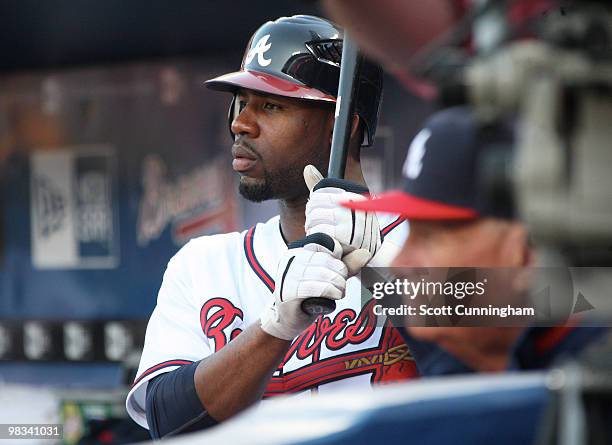 Jaon Heyward and Manager Bobby Cox of the Atlanta Braves watch the action from the dugout against the Chicago Cubs at Turner Field on April 8, 2010...