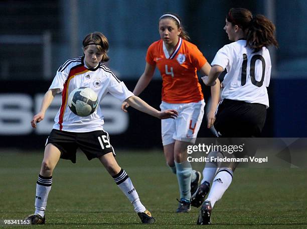 Theresa Panfil and Sara Daebritz of Germany in action with Danielle Kuikstra of Netherlands during the Women's U15 international friendly match...