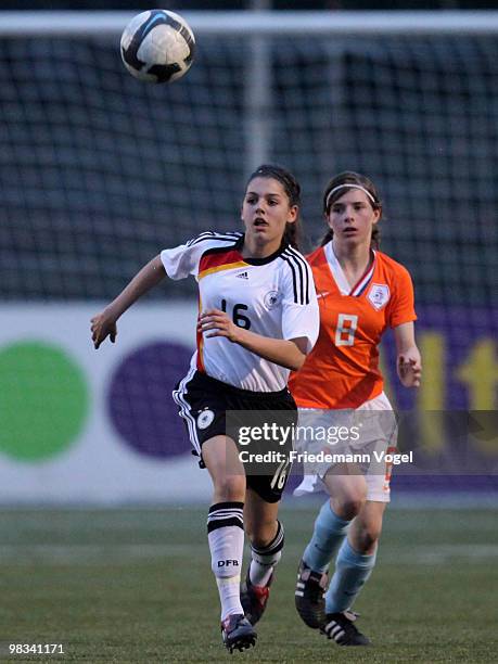 Manjou Wilde of Germany in action with Vera Berends of Netherlands during the Women's U15 international friendly match between Netherlands and...