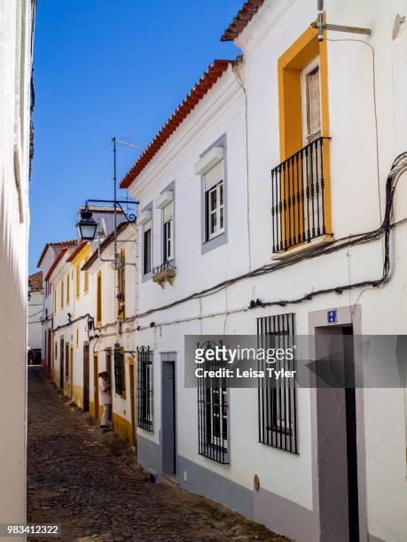 Yellow and white box houses in Evora, Alentejo Province, Portugal.