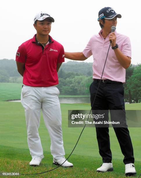 Jinichiro Kozuma of Japan is interviewed by Ryo Ishikawa of Japan after the third round of the Dunlop Srixon Fukushima Open at Grandee Nasushirakawa...