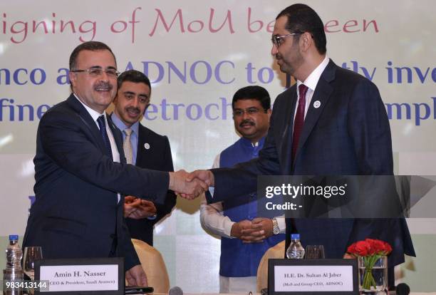 Saudi Aramco CEO Amin Nasser and Abu Dhabi National Oil Company chief executive and United Arab Emirates Minister of State Sultan Ahmed Al Jaber sign...