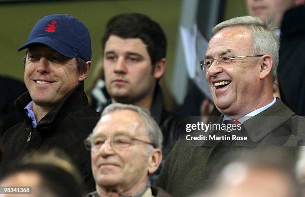 British actor Hugh Grant and Martin Winterkorn, CEO of Volkswagen seen during the UEFA Europa League quarter final second leg match between VfL...