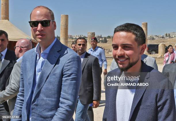 Britain's Prince William and Jordanian Crown Prince Hussein bin Abdullah visit the Jerash archaeological site, some 50 kilometers north of the...
