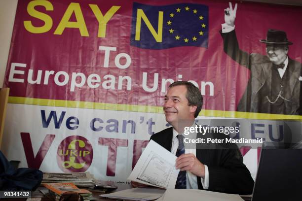 United Kingdom Independence Party member Nigel Farage sits at his desk at campaign headquarters on April 8, 2010 in Buckingham, England. UKIP Member...