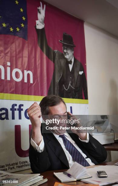 United Kingdom Independence Party member Nigel Farage sits at his desk at campaign headquarters on April 8, 2010 in Buckingham, England. UKIP Member...