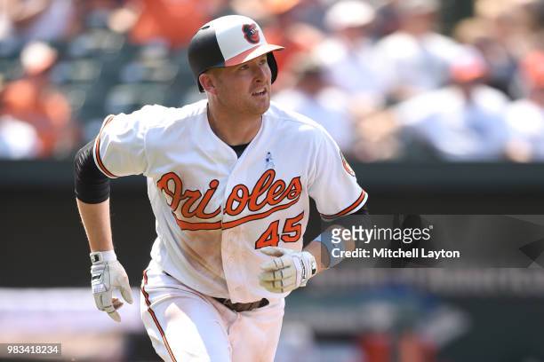 Mark Trumbo of the Baltimore Orioles runs to first base during a baseball game against the Miami Marlins at Oriole Park at Camden Yards on June 17,...