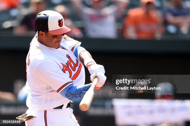 Manny Machado of the Baltimore Orioles looks on after striking outtakes a swingainst the Miami Marlins at Oriole Park at Camden Yards on June 17,...