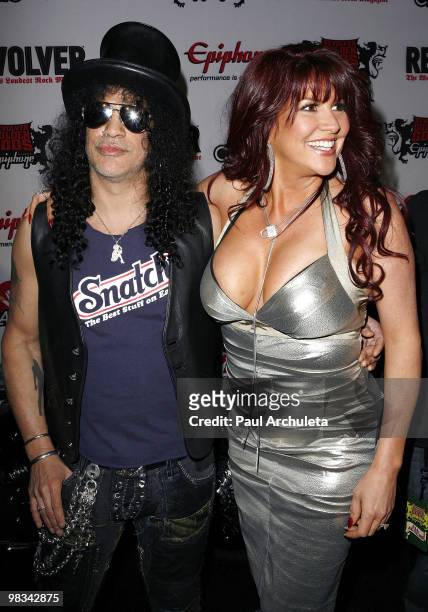 Musician Slash & his wife Perla Ferrar arrive at the 2nd annual Revolver Golden Gods Awards at Club Nokia on April 8, 2010 in Los Angeles, California.