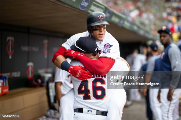 Logan Morrison of the Minnesota Twins celebrates with Bobby Wilson after hitting a home run against the Los Angeles Angels on June 10, 2018 at Target...