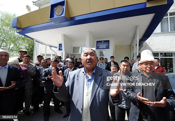 Kyrgyz men pray in front of the town hall in Jalal-Abad on April 9, 2010. Kyrgyzstan's ousted but defiant President Kurmanbek Bakiyev said today he...