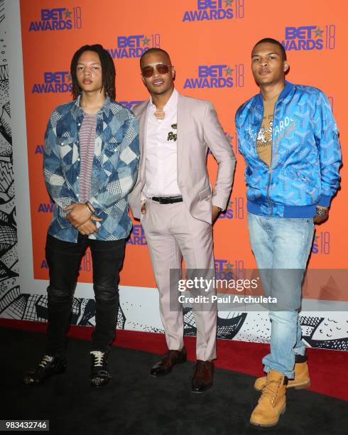 Domani Harris, T.I. And Messiah Ya' Majesty Harris pose for photos in the press poom at the 2018 BET Awards at Microsoft Theater on June 24, 2018 in...