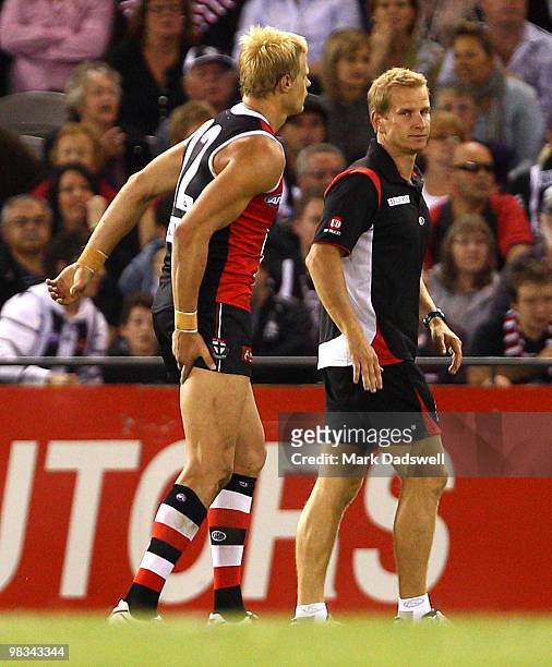 Nick Riewoldt of the Saints limps from the ground holding his hamstring during the round three AFL match between the St Kilda Saints and the...