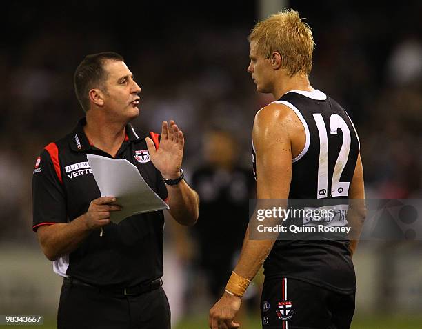 Ross Lyon the coach of the Saints speaks to Nick Riewoldt during the round three AFL match between the St Kilda Saints and the Collingwood Magpies at...