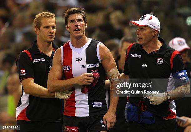 Lenny Hayes of the Saints comes from the ground with a bloody nose during the round three AFL match between the St Kilda Saints and the Collingwood...