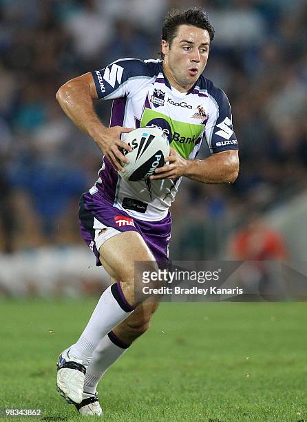 Cooper Cronk of the Storm runs with the ball during the round five NRL match between the Gold Coast Titans and the Melbourne Storm at Skilled Park on...