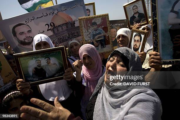 Israeli-Arab women chant slogans during a demonstration calling for the release of Palestinian prisoners from Israeli jails, at the Hadarim prison...